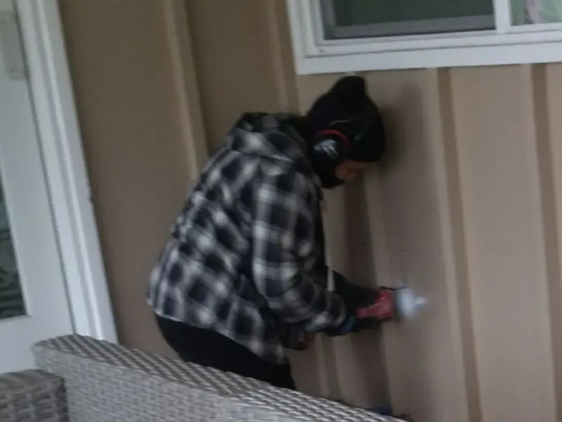 Professional electrician installing an exterior outlet in Kathleen