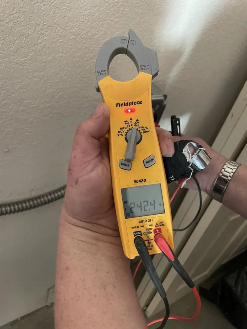 Voltage testing with clamp meter during Electrical Installation Services in Kathleen